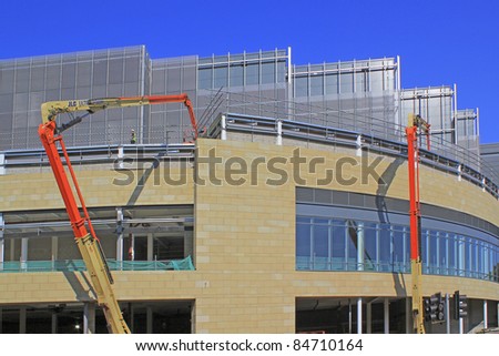 HALIFAX, UK – SEPTEMBER  15: Cranes being used in the construction of the Broad Street  Shopping development. September 15, 2011 Halifax, West Yorkshire