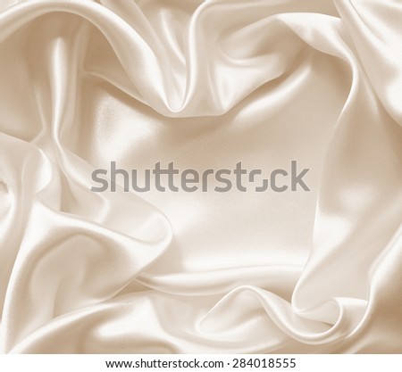 Smooth elegant golden silk or satin texture can use as wedding background. In Sepia toned. Retro style
