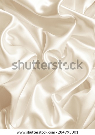 Smooth elegant golden silk or satin texture can use as background. In Sepia toned. Retro style