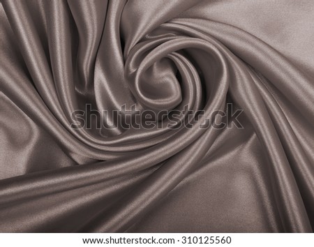 Smooth elegant brown silk or satin can use as wedding background. In Sepia toned. Retro style