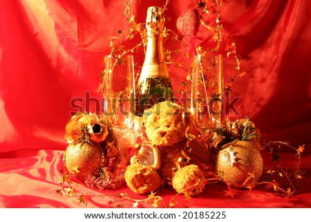 Holiday card: Close-up of  glasses, champagne bottle and bear toy