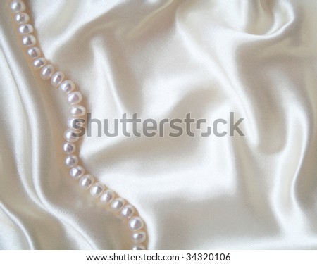 stock photo Smooth elegant white silk with pearls can use as wedding 