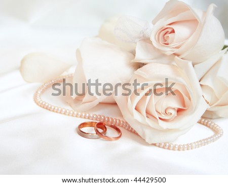 stock photo Wedding rings and roses as wedding background