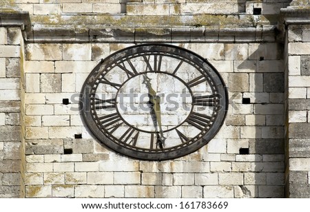 Old clock on a bell tower of church, time measure