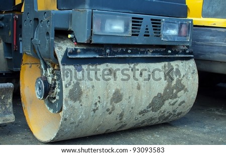road roller parked in a factory