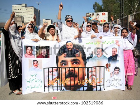PESHAWAR, PAKISTAN - MAY 14: Supporters of Muslim League-N chant slogans in favor of their demands during protest rally at GT.road on May 14, 2012 in Peshawar.