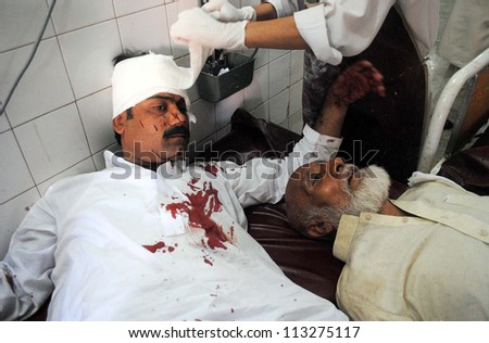 PESHAWAR, PAKISTAN - SEPT 19: Injured are being treated at local hospital, who were  injured in bomb explosion, on September 19, 2012 in Peshawar, Pakistan.