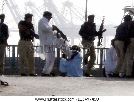 KARACHI, PAKISTAN - SEP 21: Security arrested protesters as they attempt to reach the US embassy during protest rally against blasphemy anti-Islamic movie released on September 21, 2012 in Karachi.