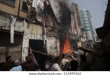 PESHAWAR, PAKISTAN - SEP 21: burning cinema that was set ablaze by angry  protesters during a protest demonstration against blasphemy anti-Islami movie released on September 21, 2012 in Peshawar.