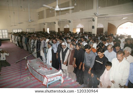 KARACHI, PAKISTAN - NOV 29: Shiite Muslims offer funeral prayer of Hassan Mohsin who gunned down by the unidentified gunmen on last night in target killing, on November 29, 2012 in Karachi.