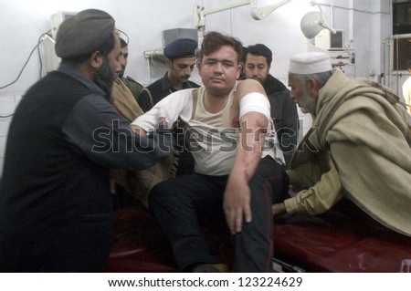 PESHAWAR, PAKISTAN - JAN 01: NGO Member, Majid who got injured in an assassination attack by unidentified gunmen at Sawabi, is under treatment at Lady Reading Hospital on January 01, 2013 in Peshawar.