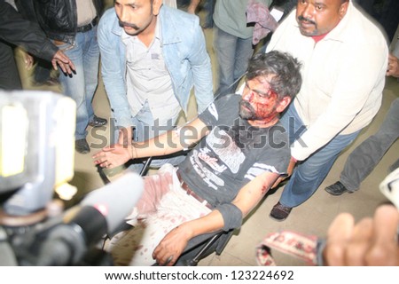 KARACHI, PAKISTAN - JAN 01: Victim of bomb blast is being shifted to Abbasi Shaheed  Hospital for treatment after bomb blast at Aisha Manzil on January 01, 2013 in Karachi.
