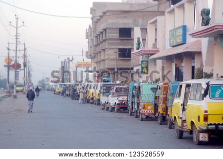 KARACHI, PAKISTAN - JAN 04: A large number of vehicles are in queue waiting for their turn to refill CNG, at a CNG Station near Korangi crossing on January 04, 2013 in Karachi.