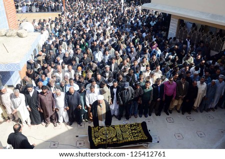 KARACHI, PAKISTAN - JAN 21: People offer funeral prayer of famous Pakistani singer Mehnaz Begum, who died at the age of 54 year in Bahrain, at Incholi Imambargah on January 21, 2013 in Karachi, Pakistan.