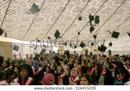 KARACHI, PAKISTAN - JAN 30: Students of Karachi University throwing their hats in air to celebrate their graduation ceremony on the occasion of Convocation 2013,  on January 30, 2013 in Karachi.