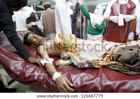 PESHAWAR, PAKISTAN - FEB 01: Victim of Hangu bomb blast being admitted at Lady  Reading Hospital for treatment, on February 01, 2013 in Peshawar. atleast 25 people killed & 50 people injured.