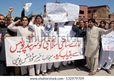 PESHAWAR, PAKISTAN, MAR 25: Members of Khyber Students Union chant slogans against high-handedness of police official and demanding to release their fellow worker on March 25, 2013 in Peshawar.