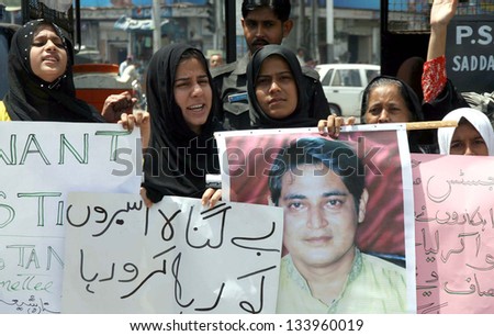 KARACHI, PAKISTAN - APR 04: Supporters women of All Pakistan Shia Action Committee chant slogans against missing of Shiite Muslim youths during protest demonstration.