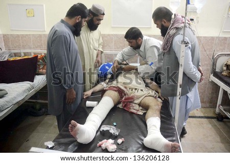 QUETTA, PAKISTAN - APR 23: Victim of Gawalmandi area bomb blast is being treated at  Civil Hospital on April 23, 2013 in Quetta. Several people were injured in three back-to-back blasts in Quetta.