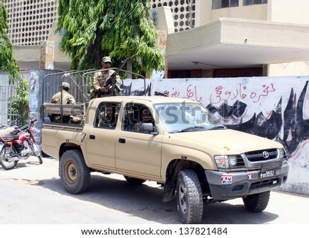 KARACHI, PAKISTAN - MAY 08: Army personnel convoy patrol in city for maintain law and order situation for upcoming General Election 2013, at New M.A Jinnah road on May 08, 2013  in Karachi.