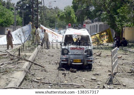 QUETTA, PAKISTAN - MAY 13: Rescue workers busy in work at the site of suicide blast on Monday, May 13, 2013 in Quetta. Eight people were killed and 97 injured in a suicide blast
