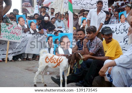 KARACHI, PAKISTAN - MAY 20: Activists of MQM are protesting against PTI chief, Imran Khan remarks made against MQM chief, Altaf Hussain, during a demonstration on May 20, 2013 in Karachi.