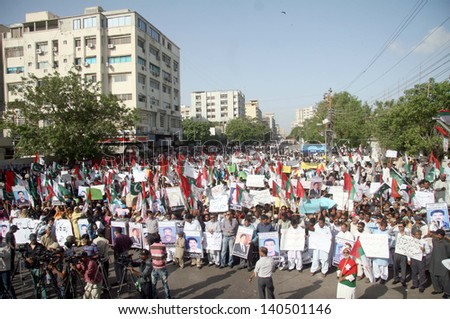 KARACHI, PAKISTAN - MAY 31: Residents of Karachi are chant slogans for recovery of missing persons during a protest demonstration arranged by Muttehida Qaumi Movement on May 31, 2013 in Karachi.