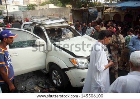 KARACHI, PAKISTAN - JUL 10: suicidal bomb blast attack on Pakistan President, security chief, Bilal Sheikh. At least three people killed and eleven others were injured  on July 10, 2013 in Karachi.