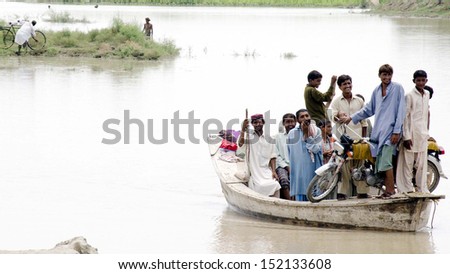 NAUNDERO, PAKISTAN - AUG 30: Views after flood in Burira village as the flood ruined  cultivations and houses in the locality of Naundero on August 30, 2013 in Naundero.