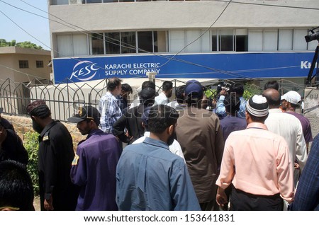 KARACHI, PAKISTAN - SEP 10: Government employees work at Civic Center are protesting against detach of electricity by Karachi Electric Supply Company, on September 10, 2013 in Karachi.