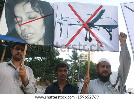 KARACHI, PAKISTAN - OCT 23: Pasban are protesting against drone attacks by U.S.A under the border limits of Pakistan and chanting slogans in favor Dr. Afia Siddiqui on October 23, 2013 in Karachi.