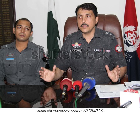 KARACHI, PAKISTAN - NOV 12: SSP East, briefs to media persons about weapons and secret documents that seized during intelligence based targeted raid in Drigh Road, on November 12, 2013 in Karachi.