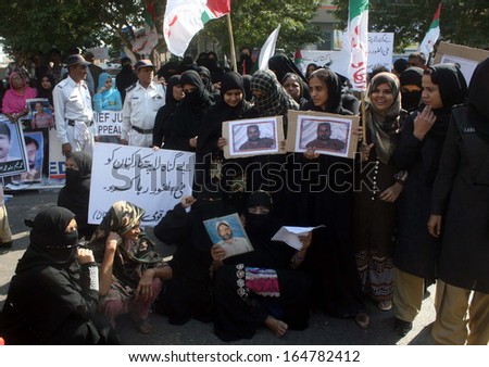 KARACHI, PAKISTAN - NOV 27: Relatives of missing persons are protesting against  kidnapping of their beloveds and demanding to Chief Justice for their recovery, on November 27, 2013 in Karachi.