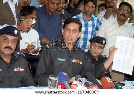 KARACHI, PAKISTAN - DEC 12: Karachi Police Chief, briefs to media persons about detained car lifters and motorcycle snatchers who arrested during raid  on  December 12, 2013 in Karachi.
