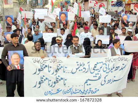 SUKKUR, PAKISTAN - DEC 18: Activists of Muttehida Qaumi Movement (MQM) chant slogans against Sindh Local Government Bill, during protest demonstration on December 18, 2013 In Sukkur.