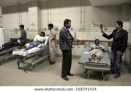KARACHI, PAKISTAN - DEC 24: Injured of bomb dual bomb blasts in Orangi Town area is being treated at Abbassi Shaheed Hospital on December 24, 2013 in Karachi.