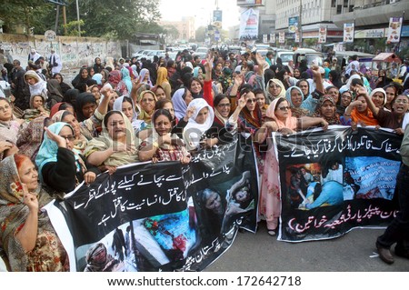 KARACHI, PAKISTAN - JAN 22: supporters of Peoples Party (Women Wing) are chanting and protesting against killing of anti polio campaigners at Qayyumabad area, on January 22, 2014 in Karachi.