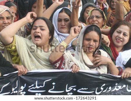 KARACHI, PAKISTAN - JAN 22: Supporters of Peoples Party (Women Wing) are chanting and protesting against killing of anti polio campaigners in Karachi on at Qayyumabad area, on January 22, 2014.