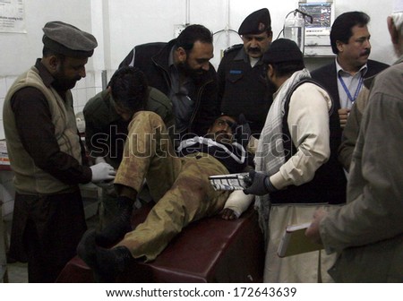 PESHAWAR, PAKISTAN - JAN 22: Victims of bomb blast which targeted a police van in  Charsadda are being treated at Lady Reading Hospital on January 22, 2014 in Peshawar.
