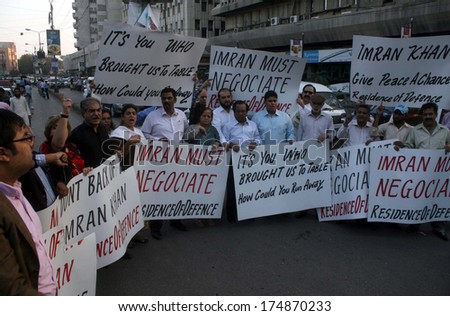 KARACHI, PAKISTAN - FEB 04: Members of Civil Society are encouraging PTI chief Imran Khan for dialogues with Taliban during a demonstration at press club on  February 04, 2014 in Karachi.