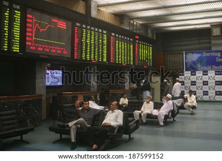 KARACHI, PAKISTAN - APR 16: Traders busy in monitoring share prices during business  timings at Karachi Stock Exchange (KSE) on April 16, 2014 in Karachi.