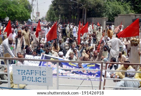 QUETTA, PAKISTAN - MAY 07: Members of Water and Sanitation Authority (WASA)  Employees Union chant slogans against non-payments of their dues salaries during protest on May 07, 2014 in Quetta.