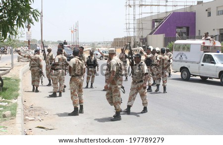 KARACHI, PAKISTAN - JUN10: Security forces are busy in search operation as they seal the whole area of Pehlwan Goth after an attack by unidentified persons on ASF camp 2 on June 10, 2014 in Karachi.