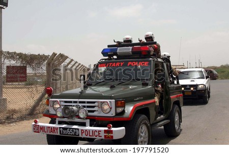 KARACHI, PAKISTAN - JUN10: Security forces are patrolling to cordon off the area after an attack by unidentified persons on Airport Security Force (ASF) camp number 2,  on June 10, 2014 in Karachi.