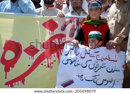 PESHAWAR, PAKISTAN - JUL 18:Jamat-e-Islami are protesting against the killing of Muslims in the Gaza Strip by Israel. 265 Palestinians have been killed and 1200 injured on July 18, 2014 in Peshawar.