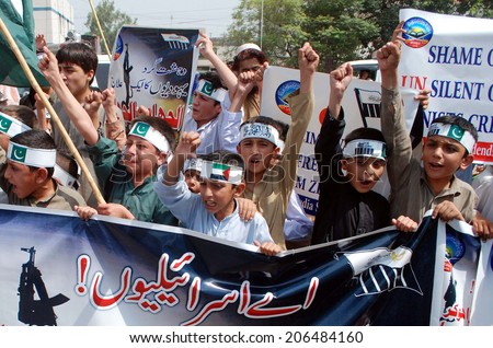 PESHAWAR, PAKISTAN - JUL 22: Al-Muhammadia Students Organization chant slogans against the killing of Muslims in the Gaza Strip by Israel. 553 Palestinians have been killed on July 22, 2014.