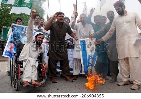 PESHAWAR, PAKISTAN - JUL 24: Awami Jamhoori are protesting against killing of Muslims in the Gaza Strip by Israel. 653 Palestinians have been killed and over 2500 injured on July 24, 2014 in Peshawar.