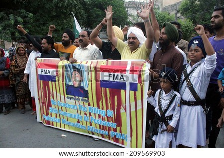 LAHORE, PAKISTAN - AUG 07: Sikh community is protesting against assassination of their people by unknown assailant in Peshawar, during protest demonstration on August 07, 2014.