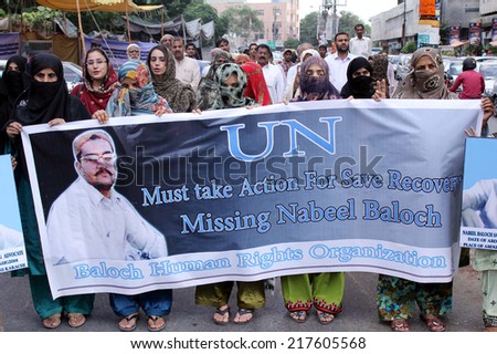 KARACHI, PAKISTAN - SEP 16: Family members of missing person, Nabeel Baloch are  demonstrating for his recovery, club on September 16, 2014 in Karachi.  (S.Imran Ali/PPI Images).