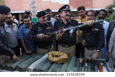 KARACHI, PAKISTAN - SEP 25: Karachi Police Chief, Abdul Qadir Thebo briefs the media regarding ammunitions carried by a truck and detention of two criminals, on September 25, 2014 in Karachi.